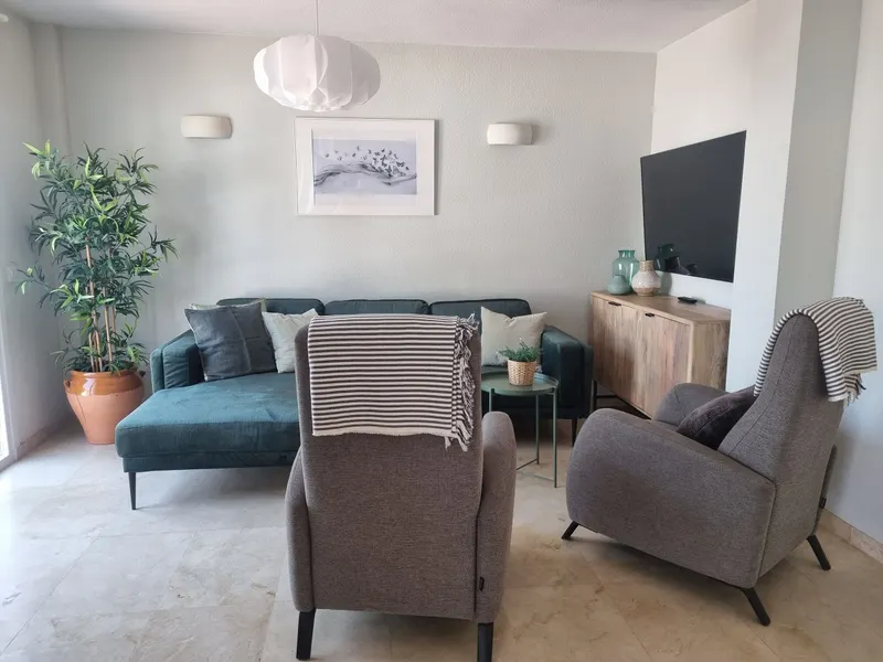 Cosy TV lounge with sofa