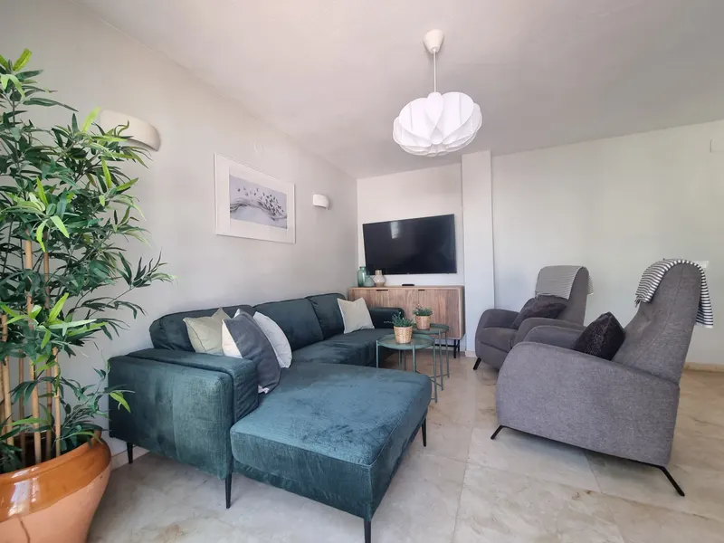 Living room with sofa and armchairs